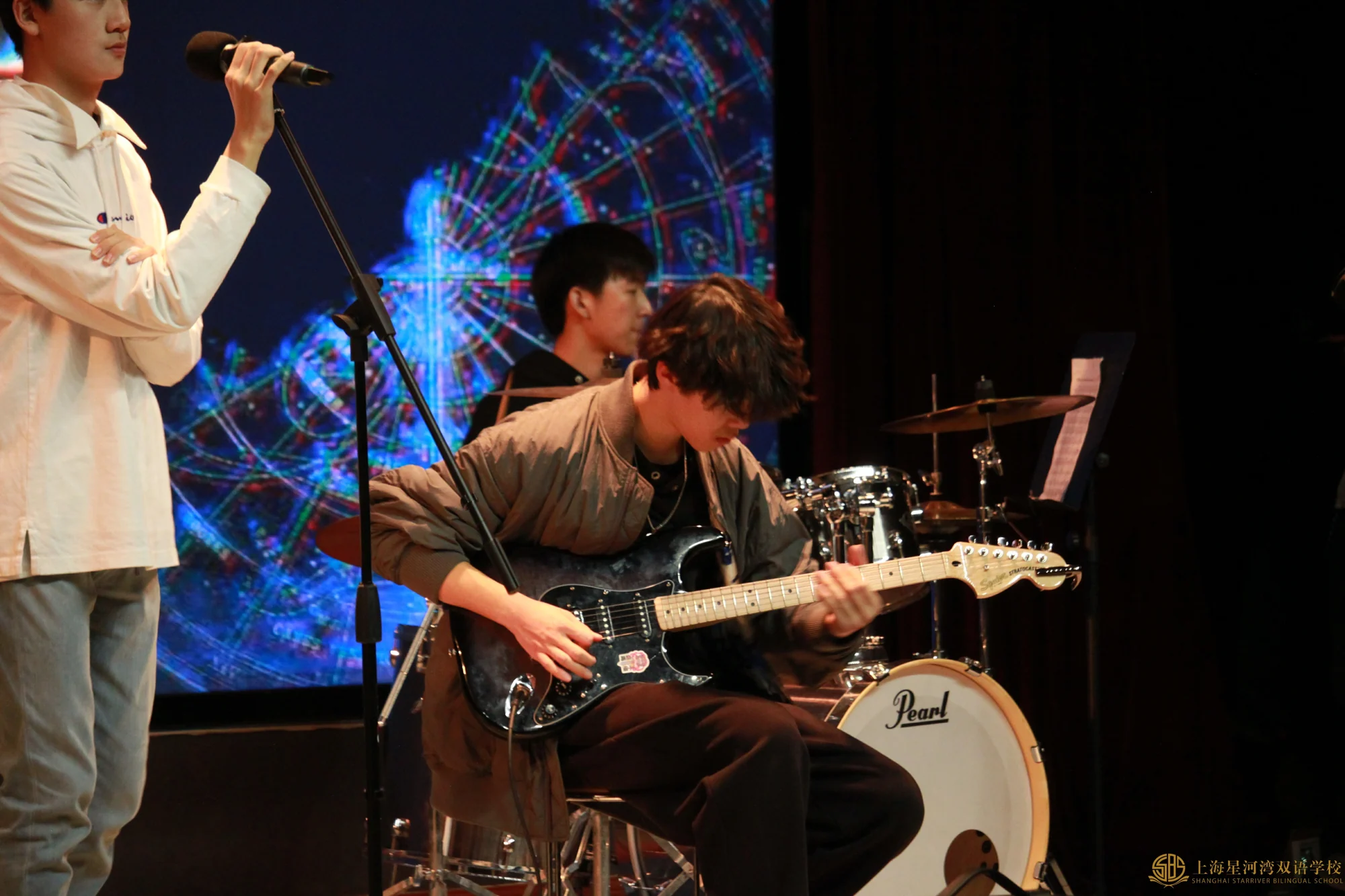 Alan playing lead guitar at the 2025 New Year Party